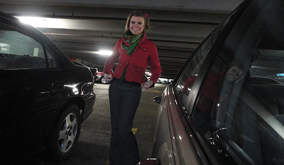 Grey wool pants, black turtleneck, green Poland-scarf, and the red jacket. I took this in a parking structure, my camera perched on my rear-view mirror. :D
