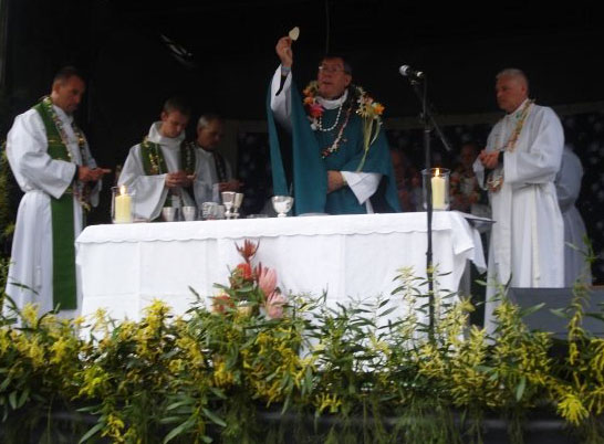 Taken in Australia. Things of note: Jesus, flowery stoles which were provided by the Islanders.