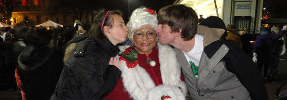 Christine and D.J. with Mrs. Claus at a holiday festivity.