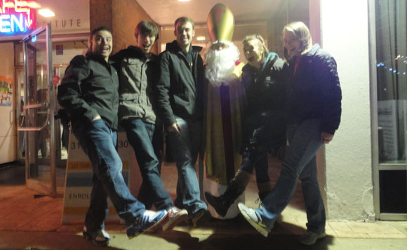 Friends encounter St. Nick at the Holiday Festival. There was no punching of noses. I had the kids present their shoes, so St. Nick could remember to fill them later! 