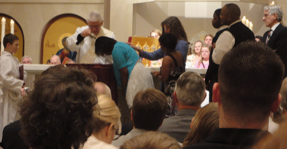 More readings, songs, and a homily that shakes your heart. And then...the baptisms begin. There were six people being baptized that night, six people whom God has chosen for the light. Is that not a breath-taking thing? To sit and see people baptized into your family of faith makes us want to burst--and so we do, we burst with applause after each person is baptized. Welcome! Welcome! Welcome to more beauty than you know how to understand. 