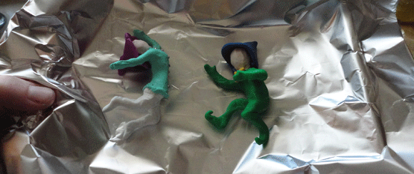 Now with hats! (And bead-buttons and a bow tie!) Here they are about to be baked. (Do you like his little curly-toe shoes?)