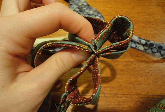 Get your fingers tangled in the delicate dance that is figuring out the adjustable part. Thank God that your coworker lent you his tie as an example. 