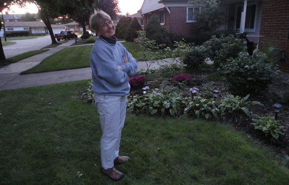 My mom in her garden as the sun was falling, hence the blur. :)