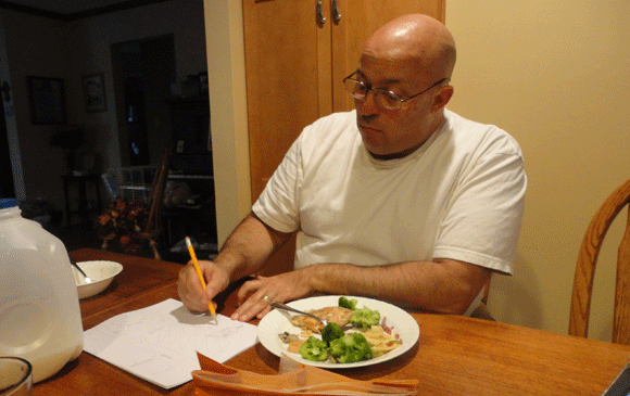 Here he's drawing a map/ graph of where he went fishing.