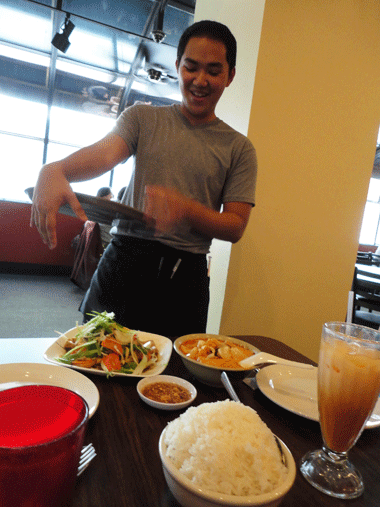 Our server, Alex, brings us our meal. 