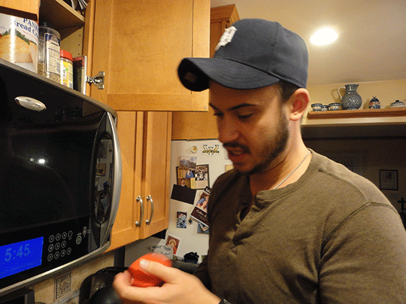 Josh cooking with me. Probably mocking my gf/ mf snacks. 