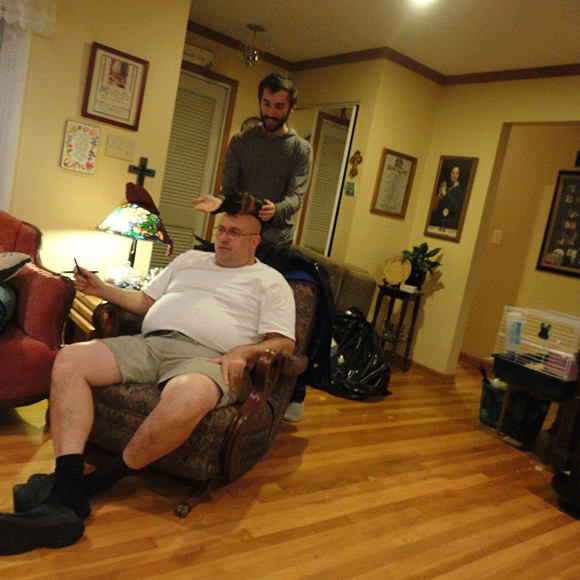 Here Joe is putting Kiwi on my father's bald head. This also happened in real life. 