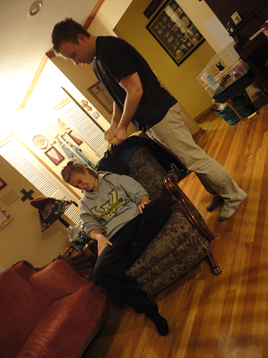 Here is a picture of Paul squeezing air onto Christine's face via a whoopee cushion.  This happened in real life. 