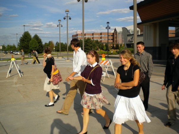 This is one of my favorite pictures of my collegiate experience. Stolen from Conor. I'm looking away from the camera, adjusting my earring and talking across a parking lot to Topher&crew. I had literally convinced everyone to go and see "Up" and then get our "family photos" taken at the mall. Whaaaaaat?