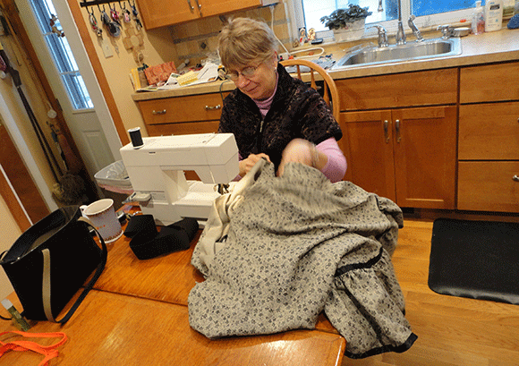 Sewing. And my mom, "But my hair isn't fixed!"  It happens. 