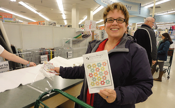 I ran into Amy, my mom's friend, today in the fabric store. She's buying material for a quilt. 