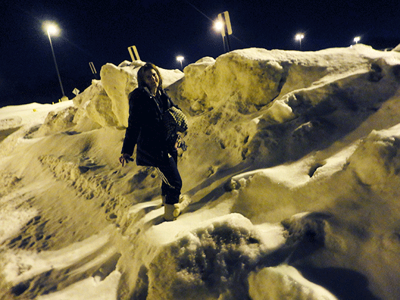 Finally, for your entertainment, a picture of Christine in the snow piles in the parking lot as we exit swim class. Yes. Winter has been like this. 