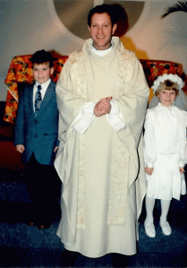 First Communion! With Dave and the priest. Father...Bill? I forget. I have not forgotten those shoes, though. They served me well. 