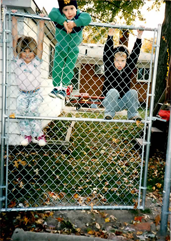 Just hangin' around on a fence. Christine, Josh, and Paul. Picture says this was in '94, Uncle Rico. 