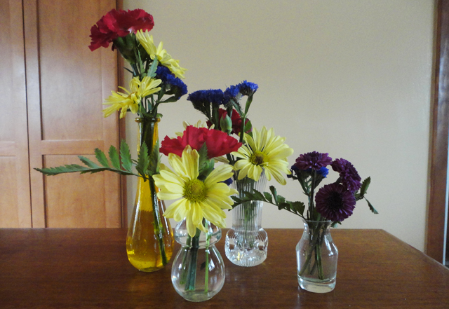 Bud vases of flowers, my favzies.