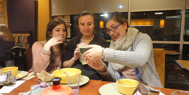 Nicolette and Christine and Brigid...laughing over a photo at a Panera on our commute home. 