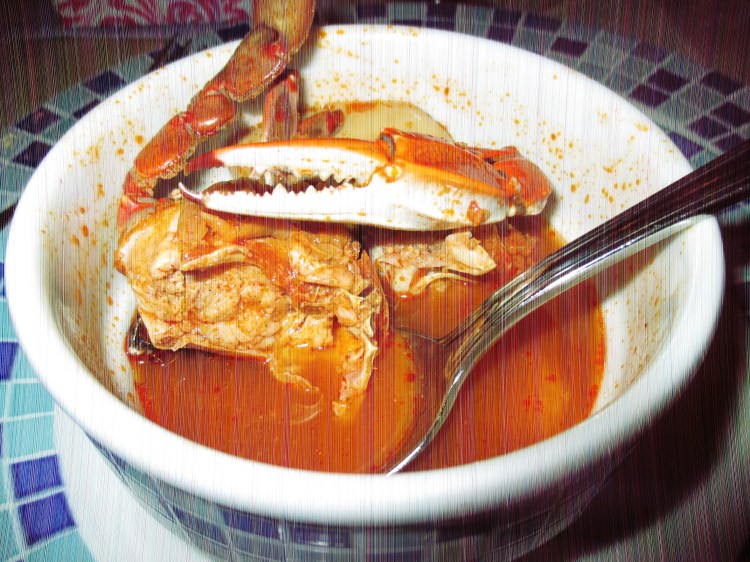 One night this was set before me.  I think the official title is probably "Ocean-bottom soup" or something like that.  Yes, yes, those are claws on claws inside. And octopus tentacles. And crustacean wiggly-bits.  Again with the sticker. 